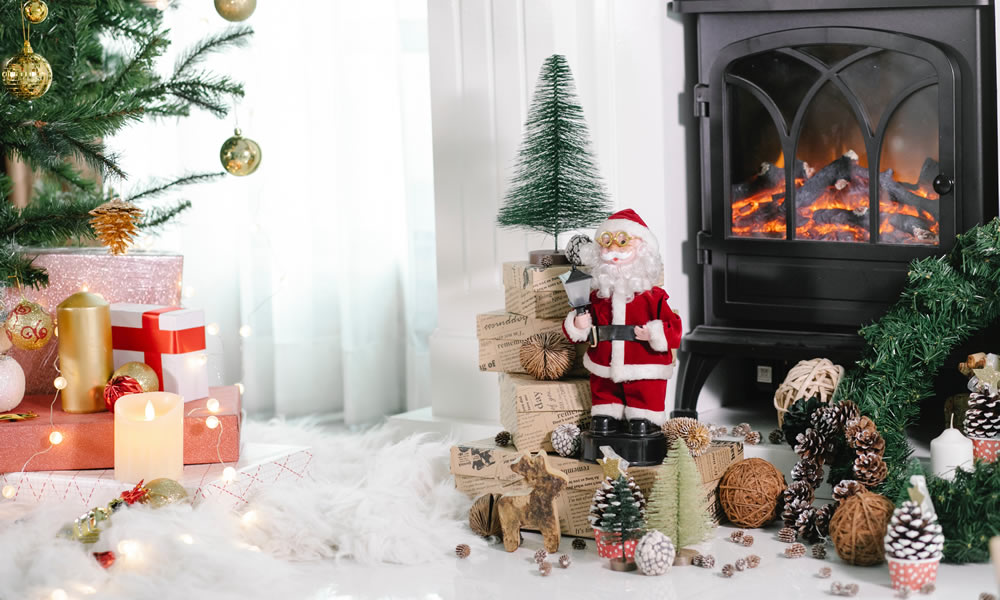 Christmas scene with santa figure by a cosy fire